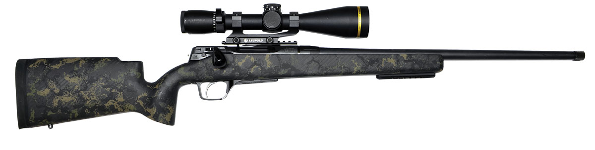 Strasser Model RS 700 fitted with a Leupold VX-6HD 3-18x 50mm riflescope, in Alpine Green stock, as it comes from the factory. In 6.5mm Creedmoor, it has a 22-inch barrel, threaded for a muzzle brake, Picatinny rail on the receiver for a scope mount, rain on the underside of the forend for a bipod, and is fitted with a Timney Elite Hunter trigger set at 2.5 pounds.